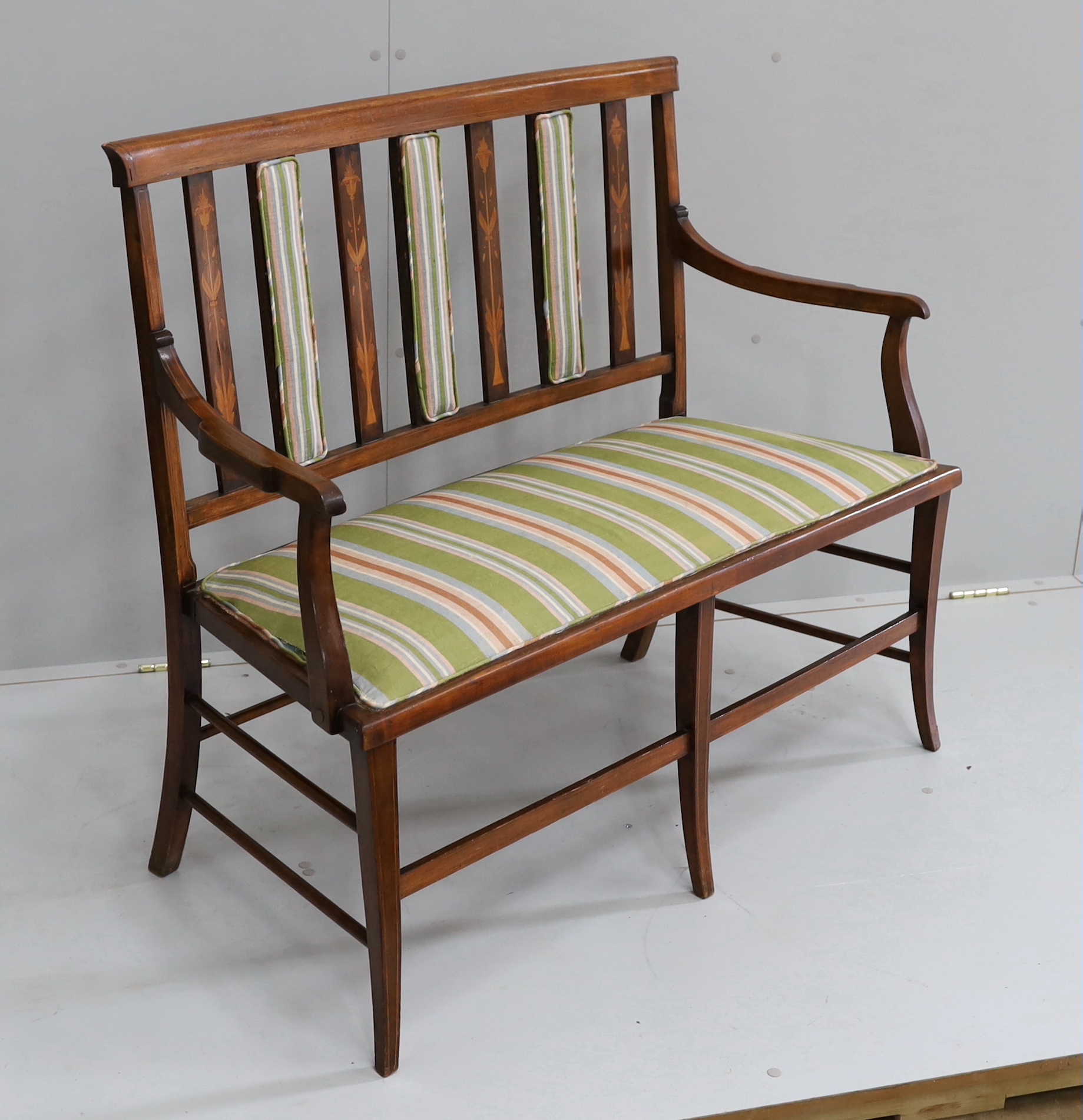 An Edwardian Art Nouveau inlaid mahogany salon settee, length 109cm, depth 46cm, height 92cm